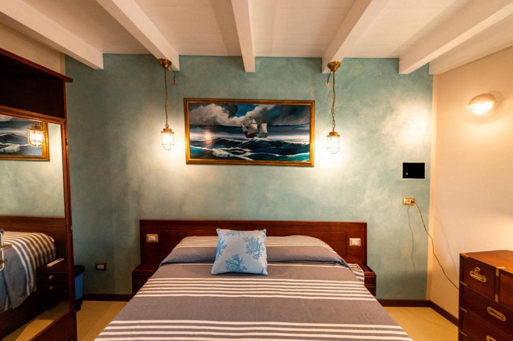 Postel nebo postele na pokoji v ubytování Le Tre Caravelle
