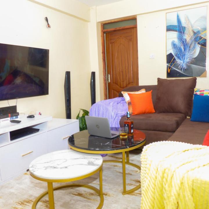 TV a/nebo společenská místnost v ubytování Forest Cabins