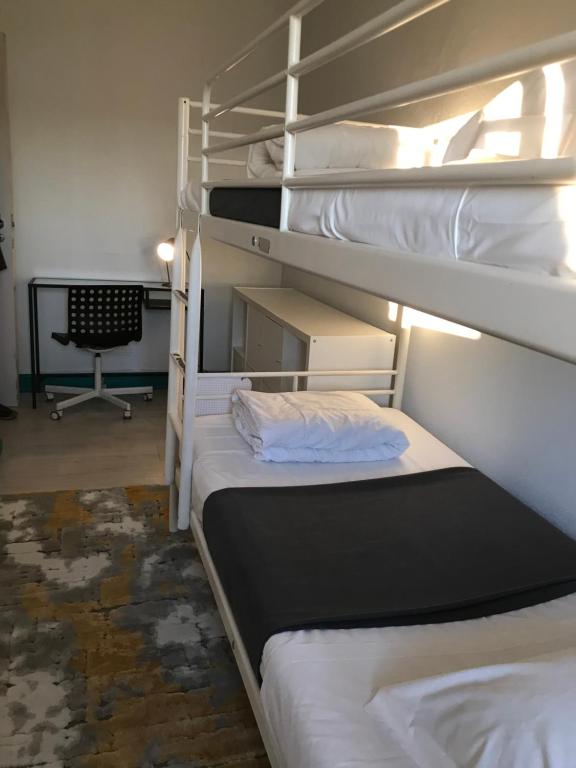 Postel nebo postele na pokoji v ubytování My Hostel