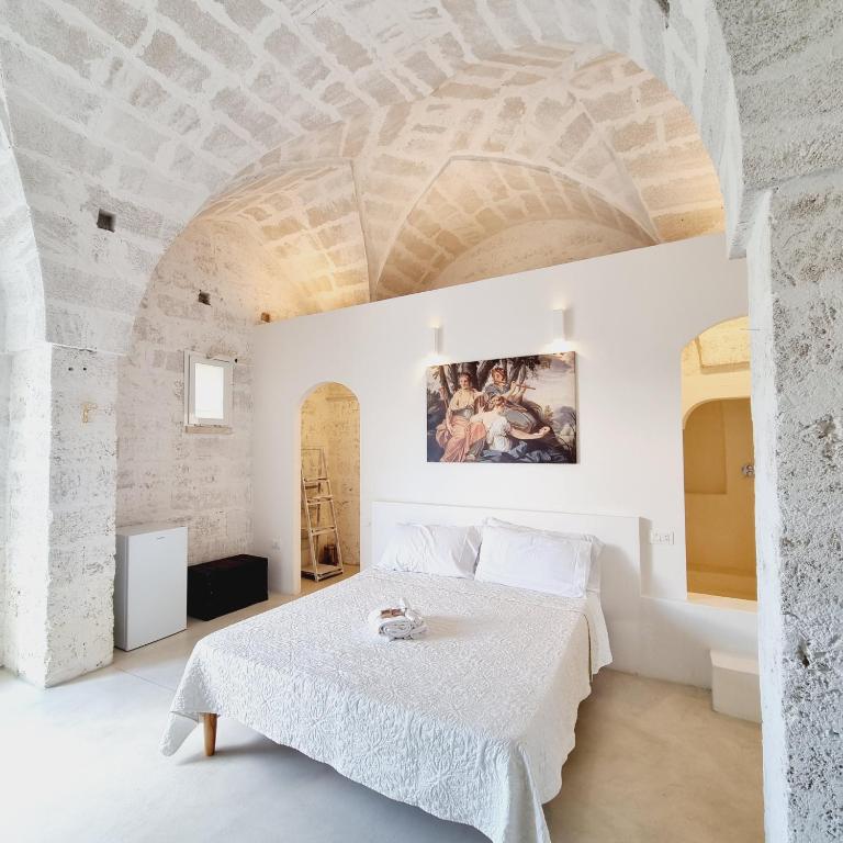 Postel nebo postele na pokoji v ubytování Corte Mercurio B&B