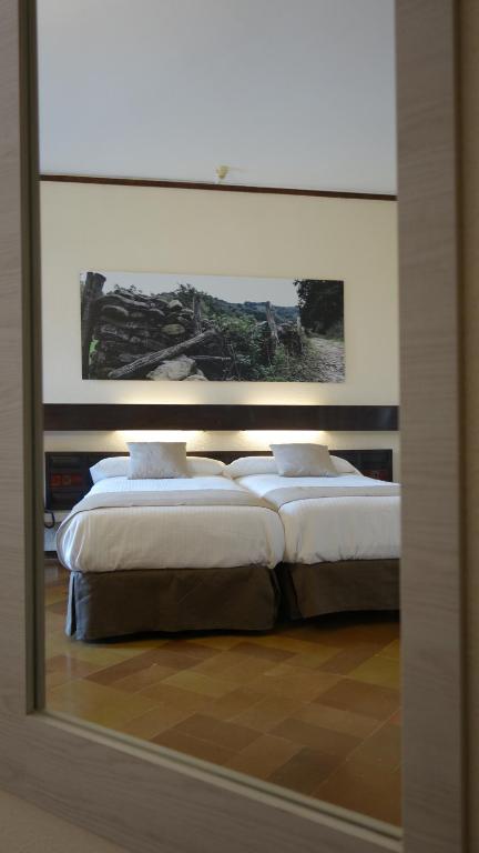 Postel nebo postele na pokoji v ubytování Hotel Baztan