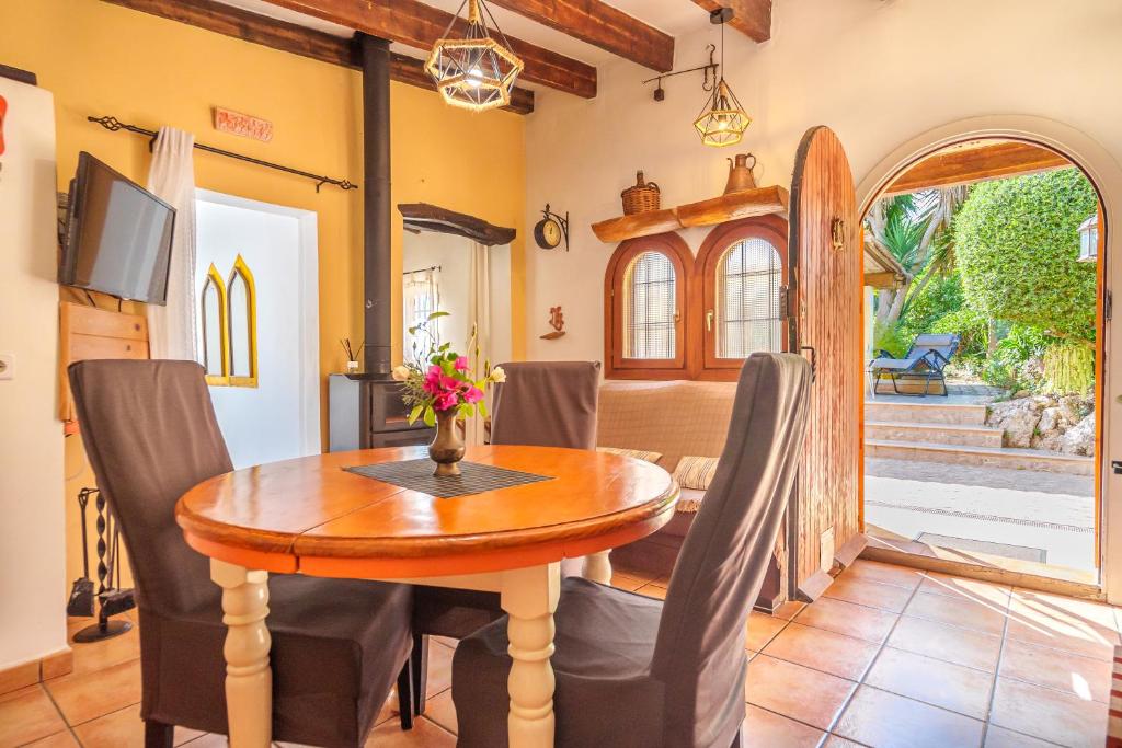 A television and/or entertainment centre at Villa KASHMIR by Mallorca Villa Selection