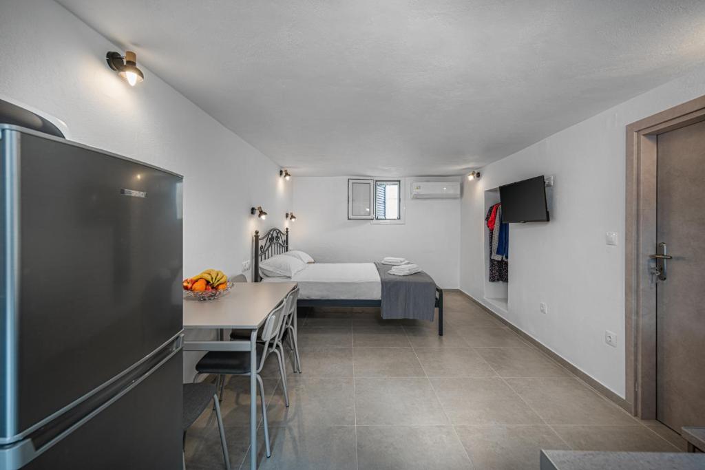 Postel nebo postele na pokoji v ubytování Michalis Home