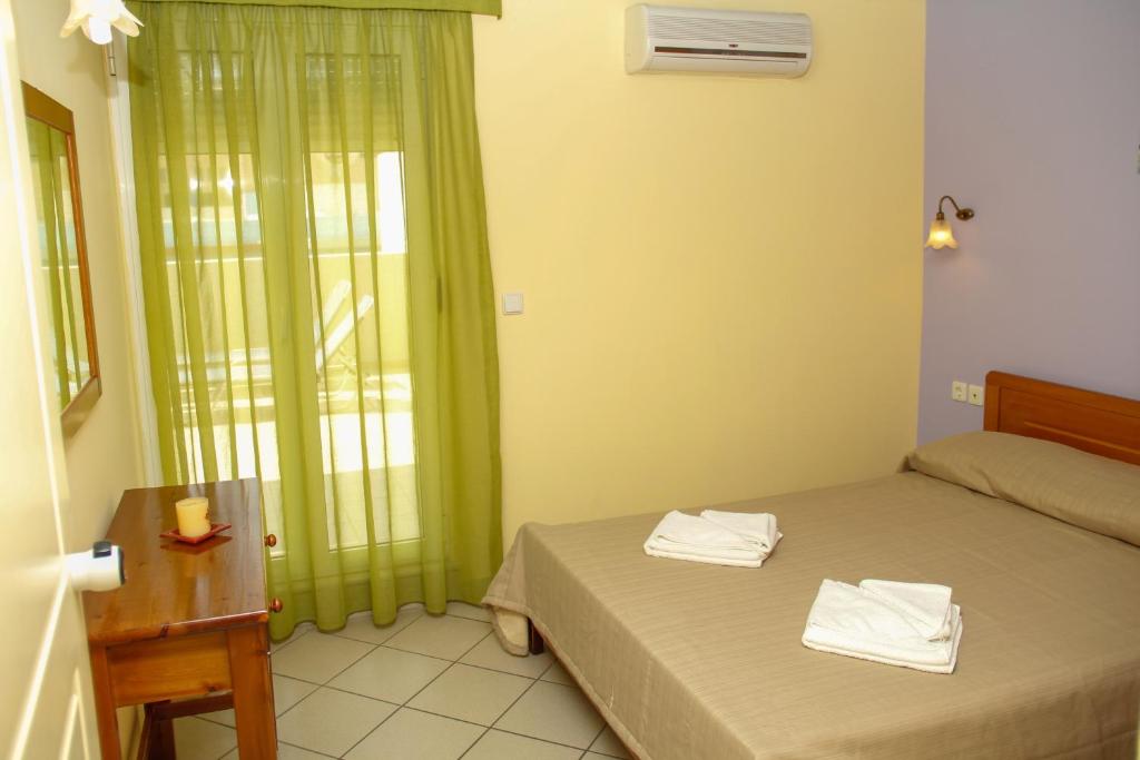 A bed or beds in a room at Kleoniki Mare