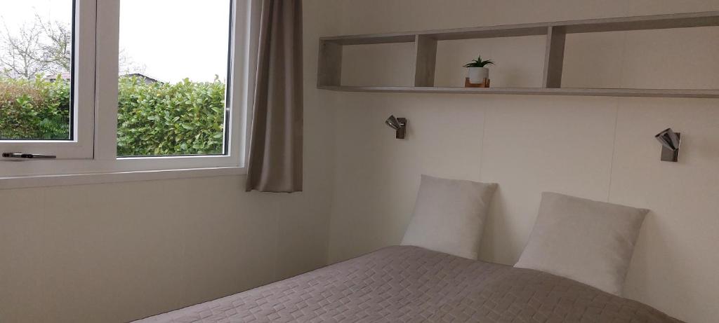 Postel nebo postele na pokoji v ubytování Tinyhouse