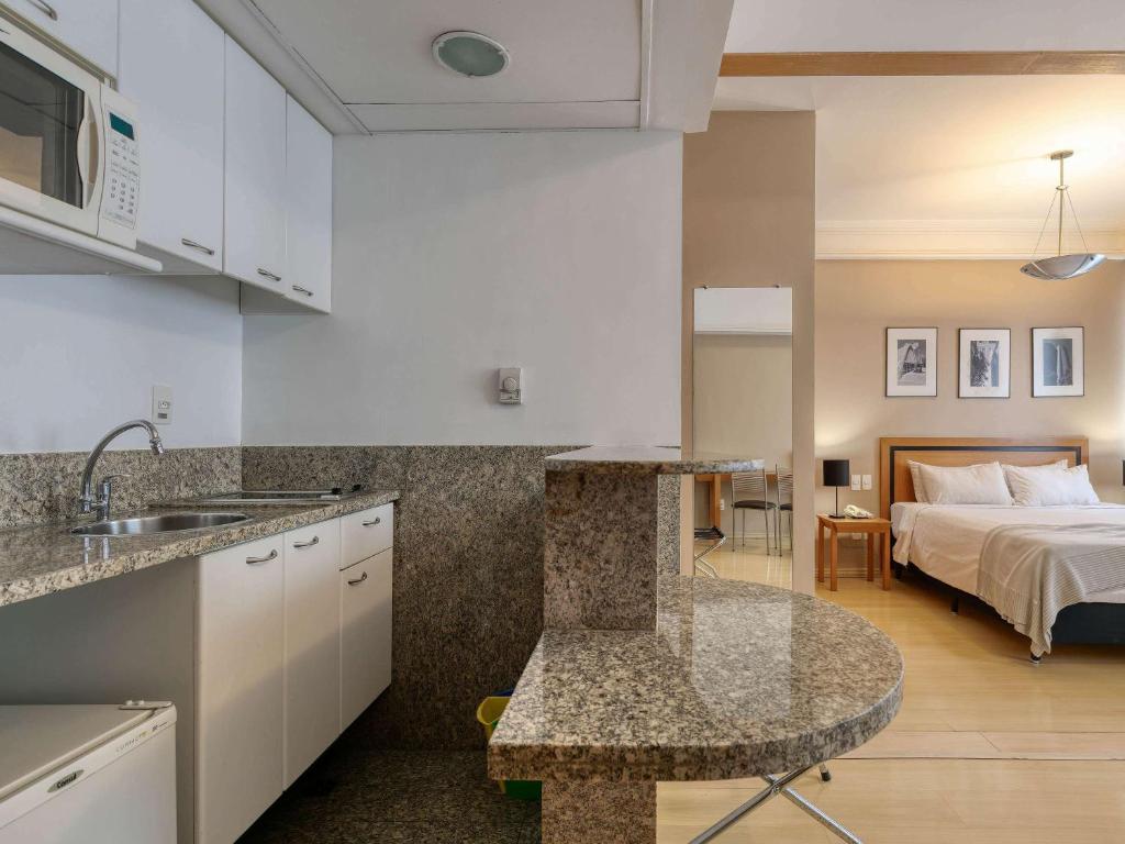 Cama ou camas em um quarto em Mercure Belo Horizonte Savassi