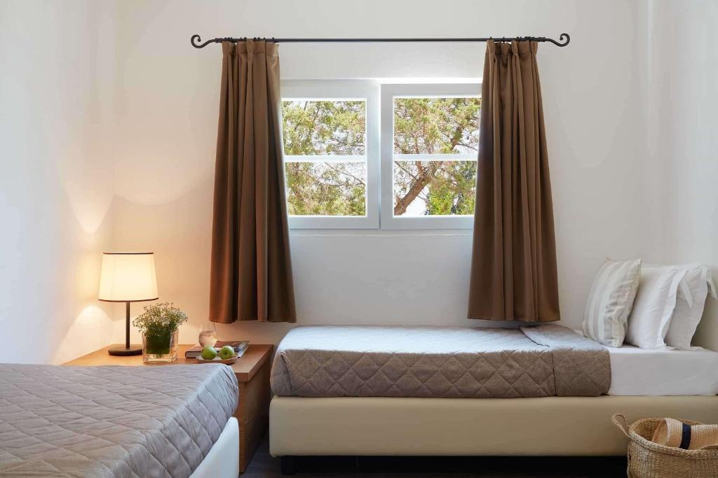 Postel nebo postele na pokoji v ubytování Hydra Beach Resort