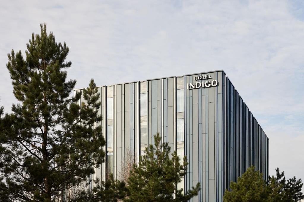 a building with a sign on the side of it at Hotel Indigo Coventry, an IHG Hotel in Coventry