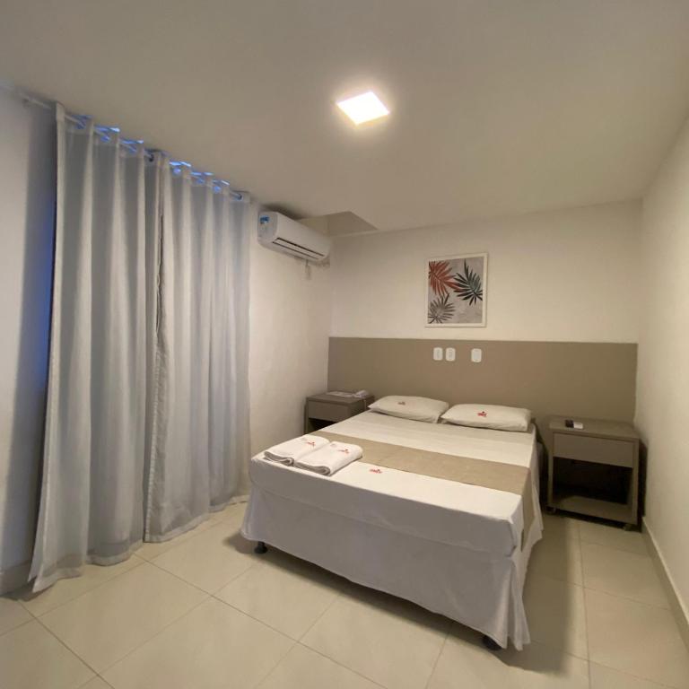 Postel nebo postele na pokoji v ubytování Onix Hotel Praia de Piata
