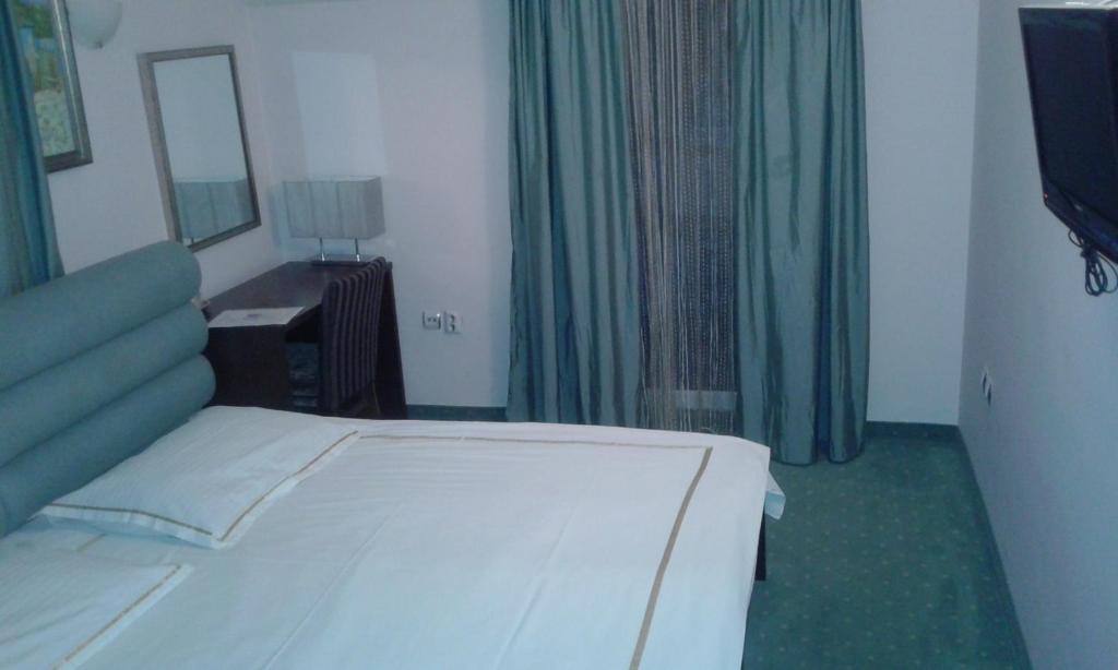 Postel nebo postele na pokoji v ubytování Vila Apolo