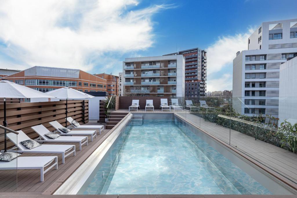 a swimming pool on the roof of a building at Luxury Sancho with a Pool in Barcelona