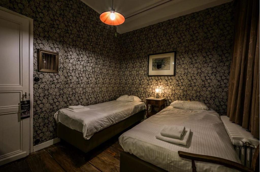 Łóżko lub łóżka w pokoju w obiekcie Talbot House