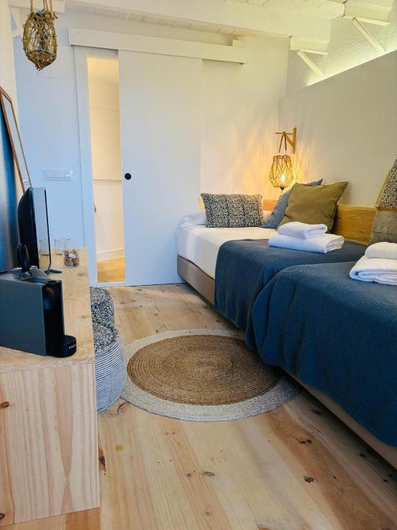 Postel nebo postele na pokoji v ubytování Hostal Sa Teula