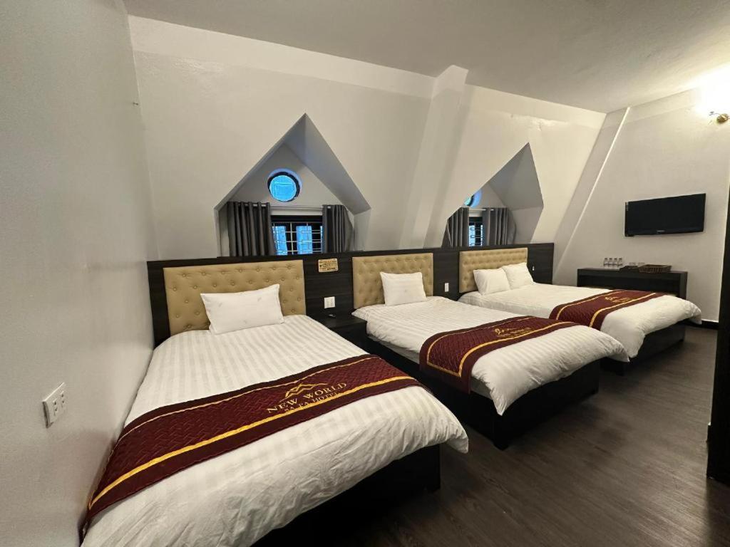 Ένα ή περισσότερα κρεβάτια σε δωμάτιο στο New World Sapa Hotel - by Bay Luxury