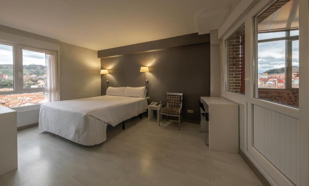 Postel nebo postele na pokoji v ubytování Hotel Bilbi