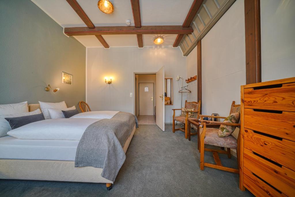 Postel nebo postele na pokoji v ubytování Hotel Zur Eule