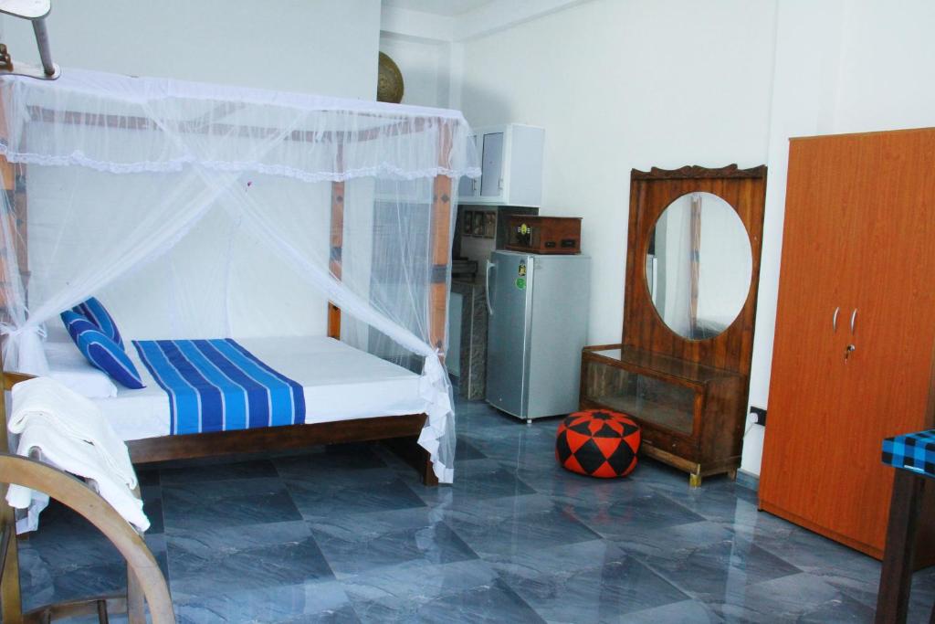 Postel nebo postele na pokoji v ubytování Mama's Hotel Weligama