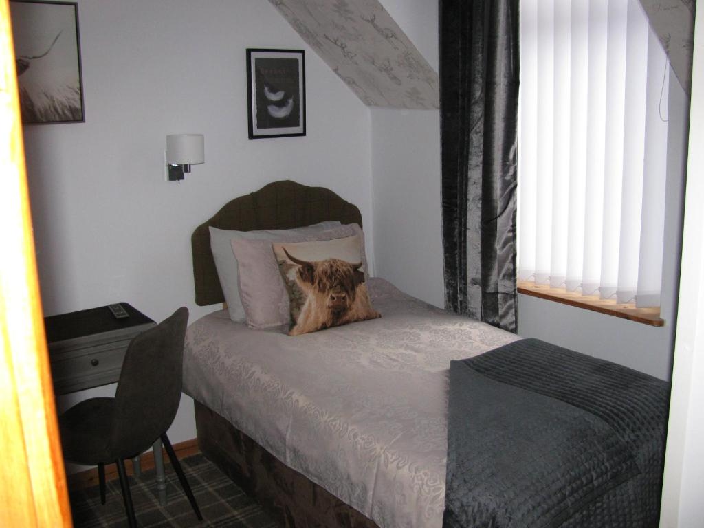 Fairfield Townhouse Guest House Selfcatering tesisinde bir odada yatak veya yataklar