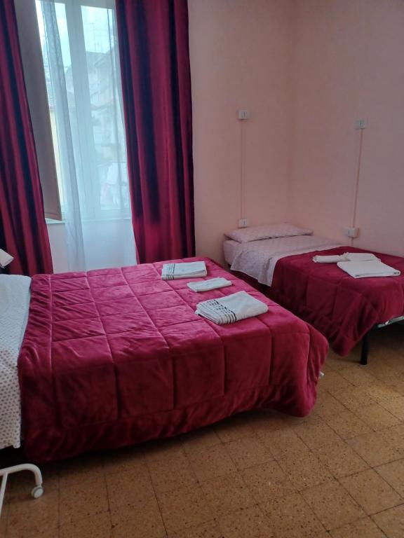 Posteľ alebo postele v izbe v ubytovaní B&B Appartamenti NAPOLI