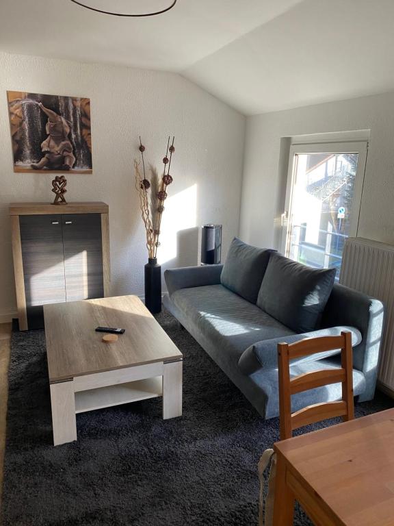 a living room with a couch and a coffee table at Haus Heiken in Altenburg