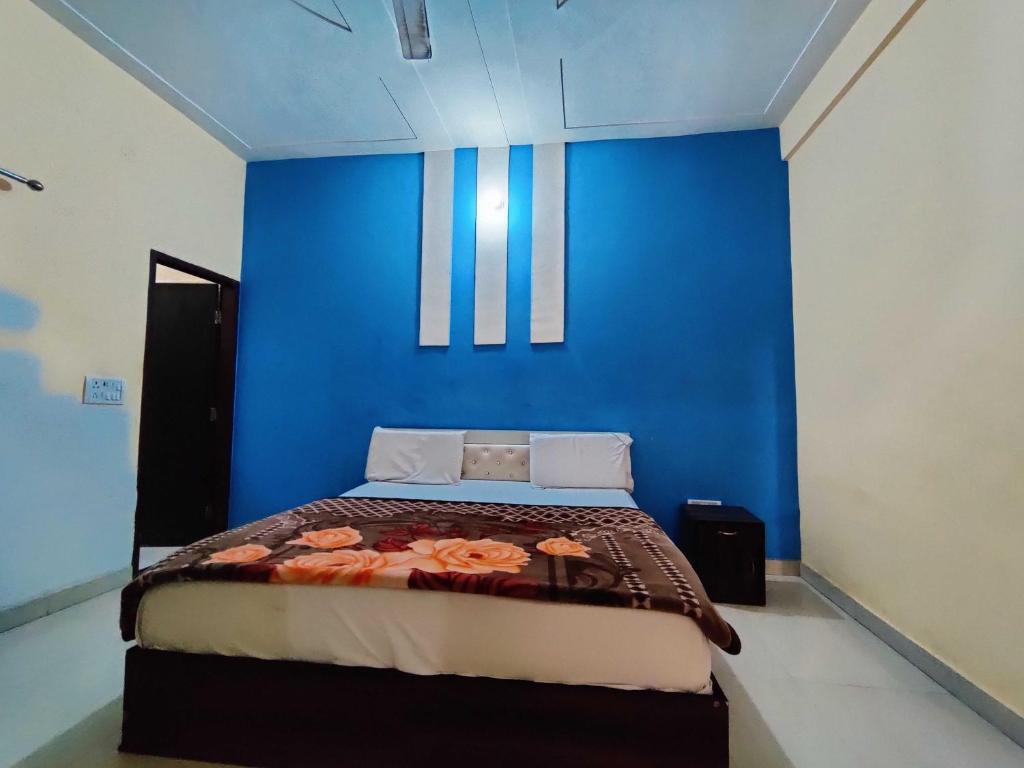 Posteľ alebo postele v izbe v ubytovaní OYO Maan Hotel