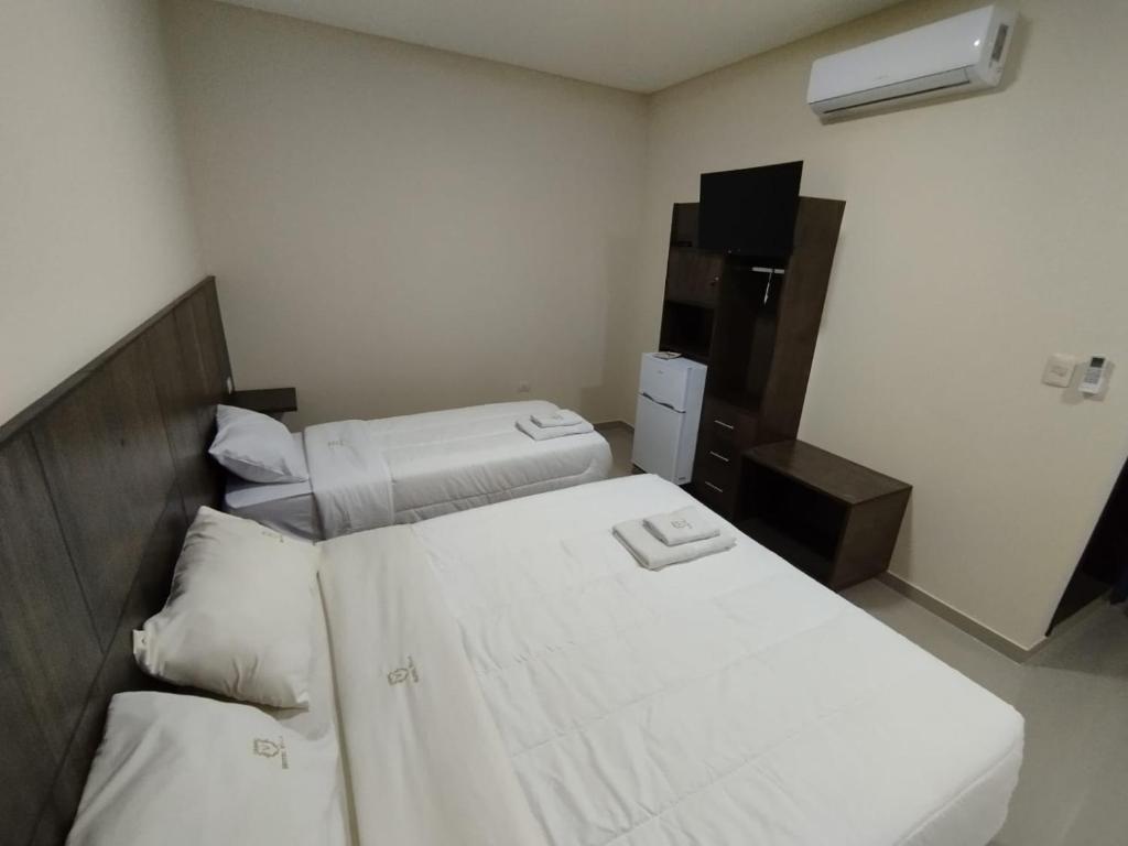 Postel nebo postele na pokoji v ubytování Hotel Villa