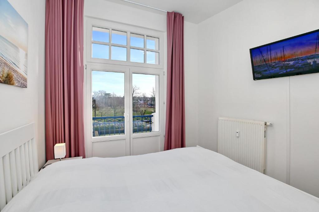 Postel nebo postele na pokoji v ubytování Haus am Park Wohnung 32
