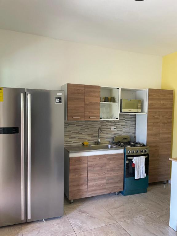Kuchyň nebo kuchyňský kout v ubytování Cozy apartment in Savaneta