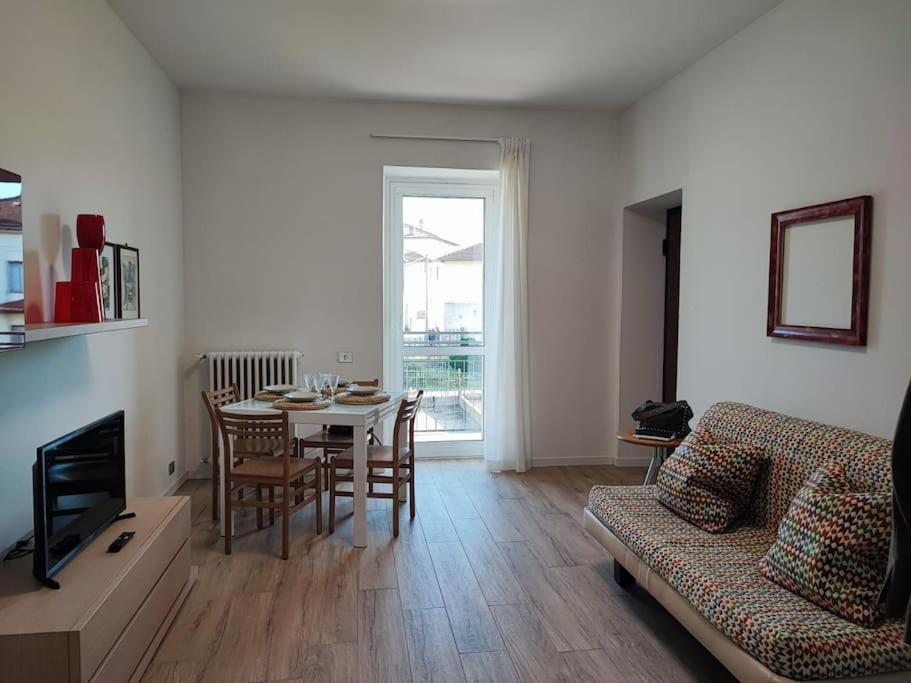 a living room with a table and a couch at [Como-Svizzera] La casa di Betty in Lurate Caccivio