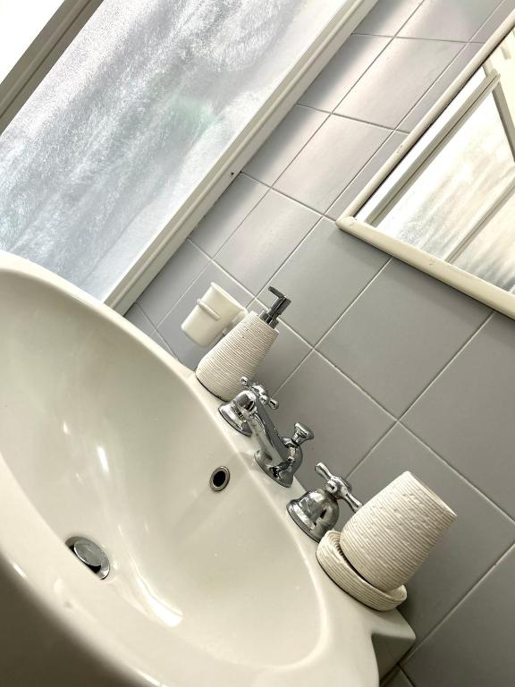 Kúpeľňa v ubytovaní MASOTTO APARTMENT LINATE-Close Center