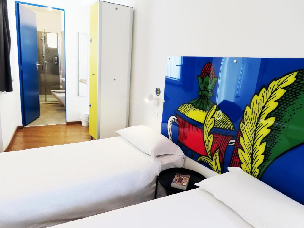 Letto o letti in una camera di Tric Trac Hostel
