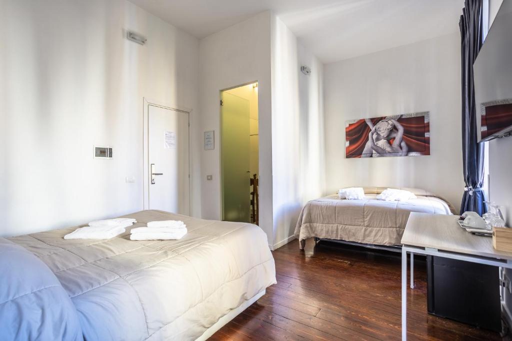 A bed or beds in a room at Relais Incantesimo Vaticano