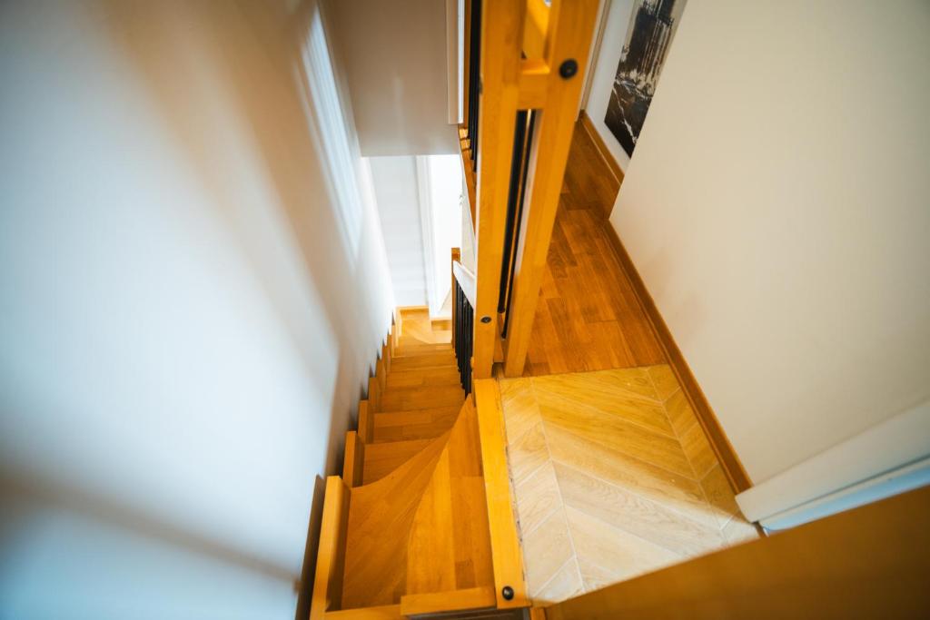 a view of a wooden staircase in a house at Hurban Apartments Muggia in Muggia