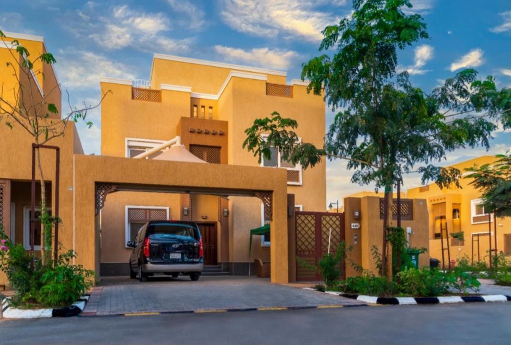 a car parked in front of a house at Villa in Al Madinah in compound فيلا في المدينة in Al Madinah