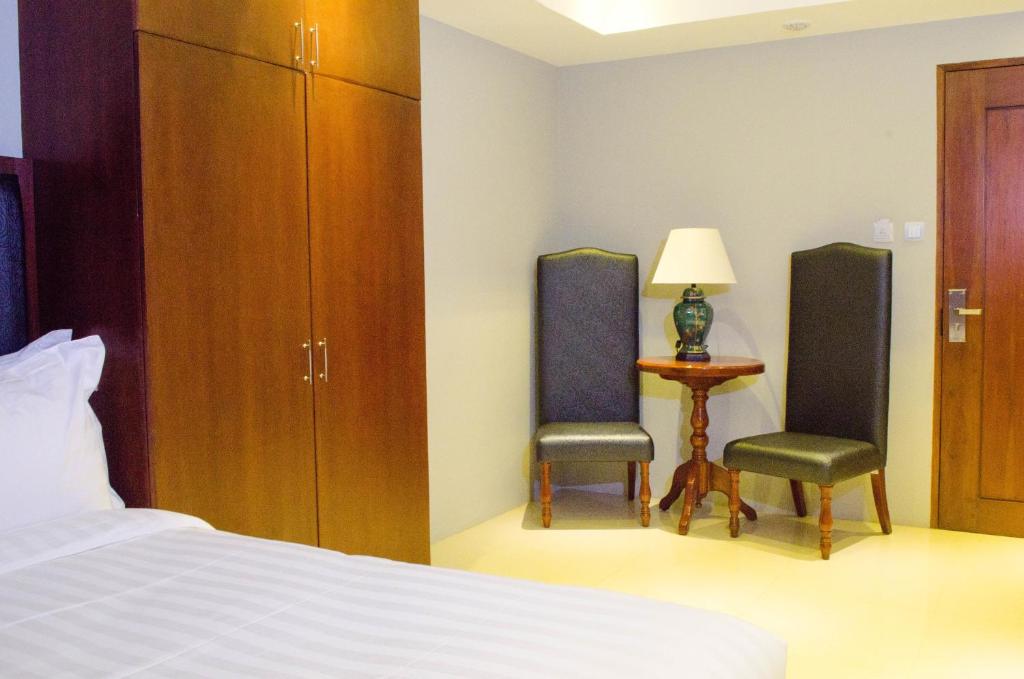Postel nebo postele na pokoji v ubytování Ritz Hotel Angeles
