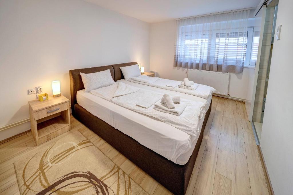 Postel nebo postele na pokoji v ubytování Apartman Nena