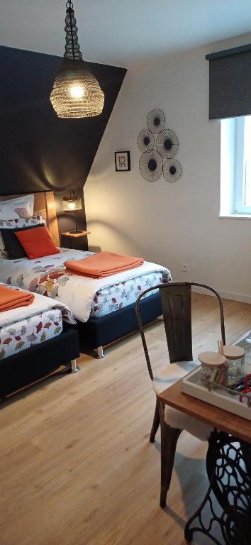 Postel nebo postele na pokoji v ubytování Maison d'Hôtes "L'ORIGINALE"