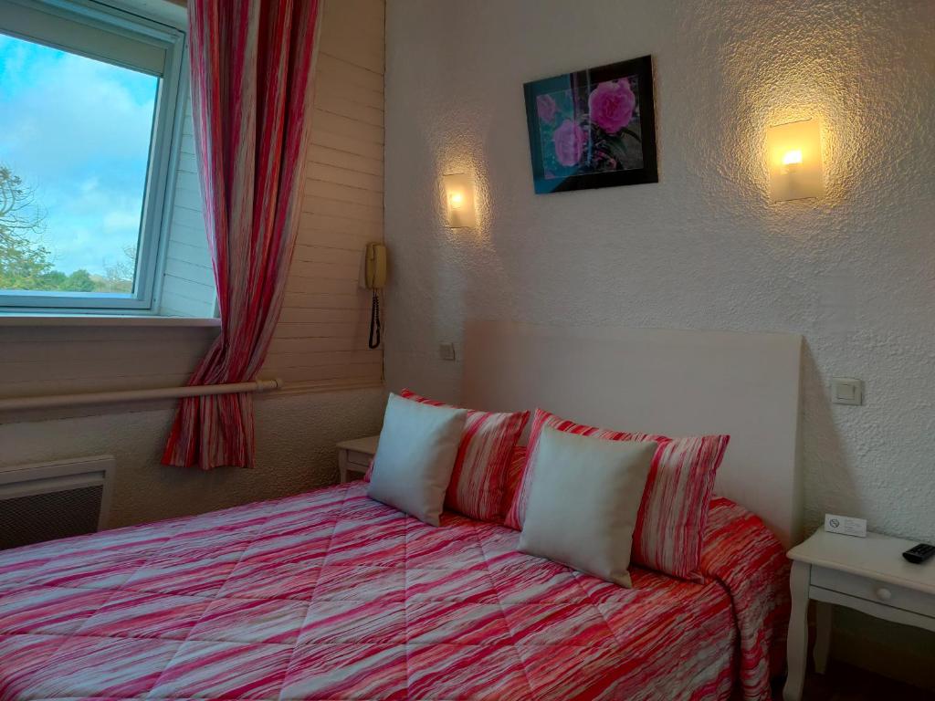 Postel nebo postele na pokoji v ubytování Hôtel le Littoral
