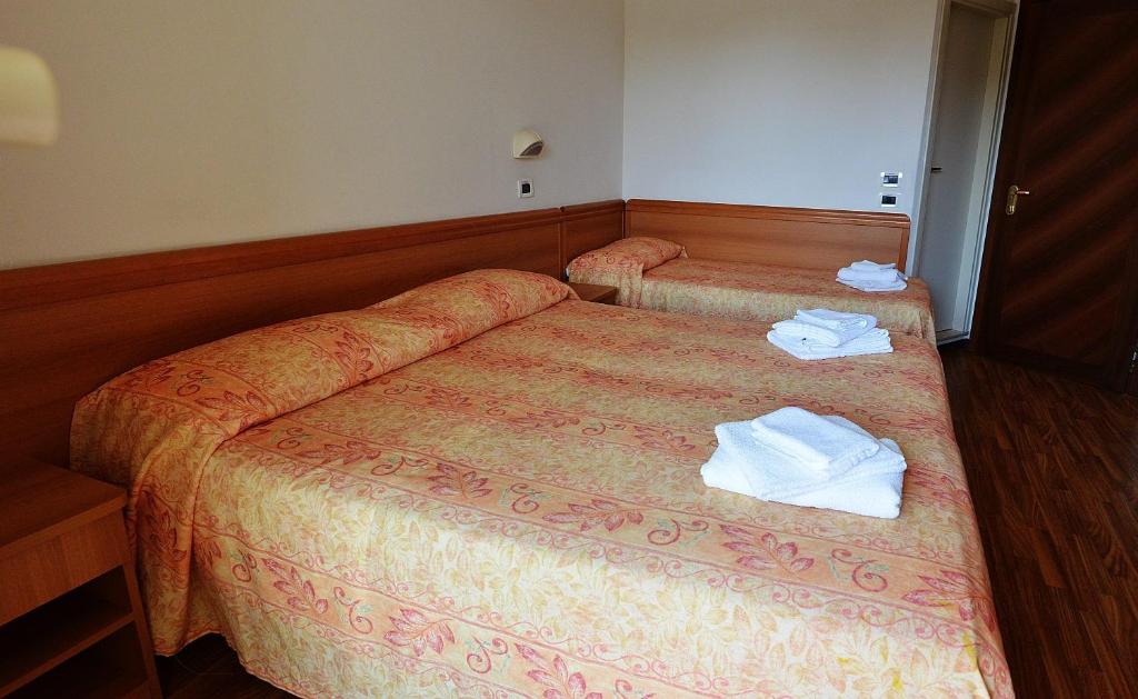 Postel nebo postele na pokoji v ubytování Hotel Bamar