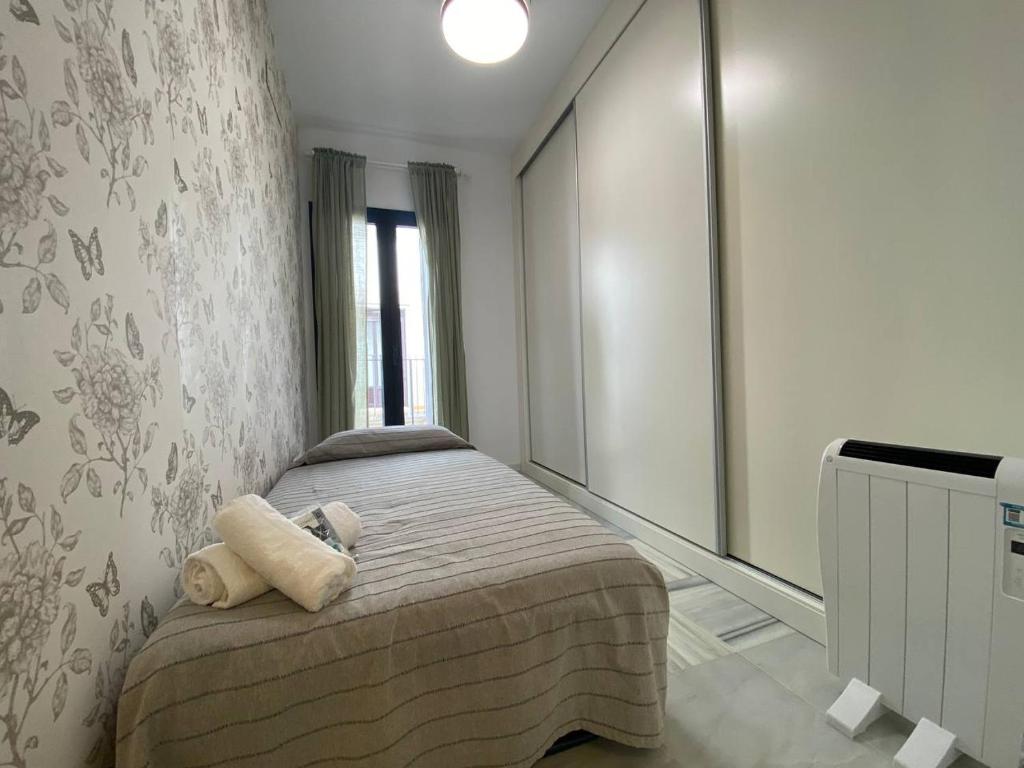 Postel nebo postele na pokoji v ubytování Dúplex en casco histórico, terraza, garaje, Wi-Fi