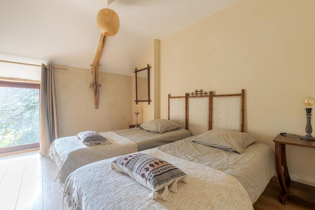Postel nebo postele na pokoji v ubytování Gîte à la campagne, 30 min des plages du Morbihan