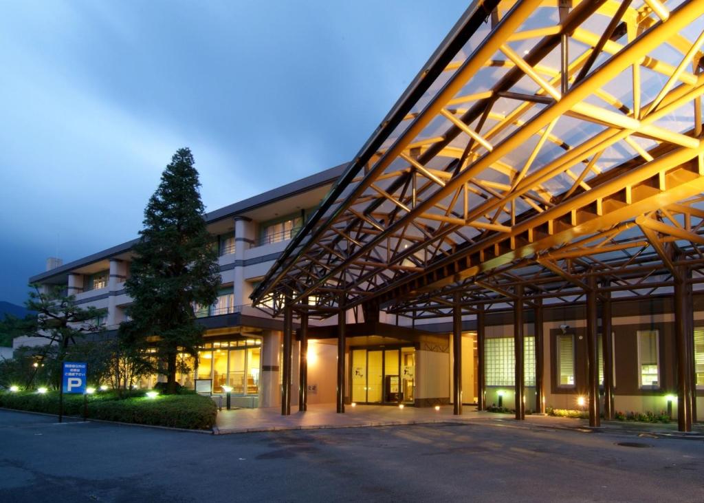 a large building with a lot of windows at Route Inn Grantia Fukuoka Miyawaka - Wakita Onsen in Miyawaka