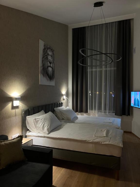 Postel nebo postele na pokoji v ubytování Triangle Rooms