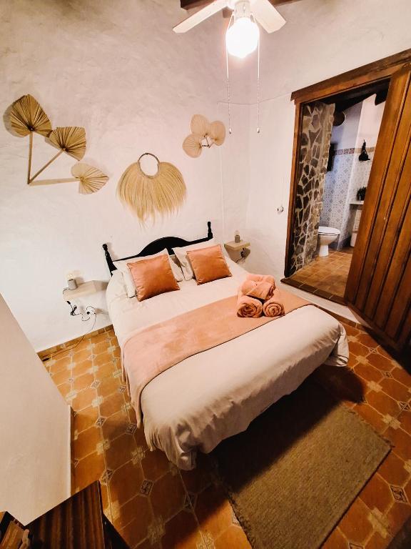 Postel nebo postele na pokoji v ubytování Finca Los Burros