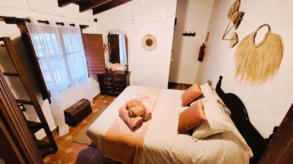 Postel nebo postele na pokoji v ubytování Finca Los Burros