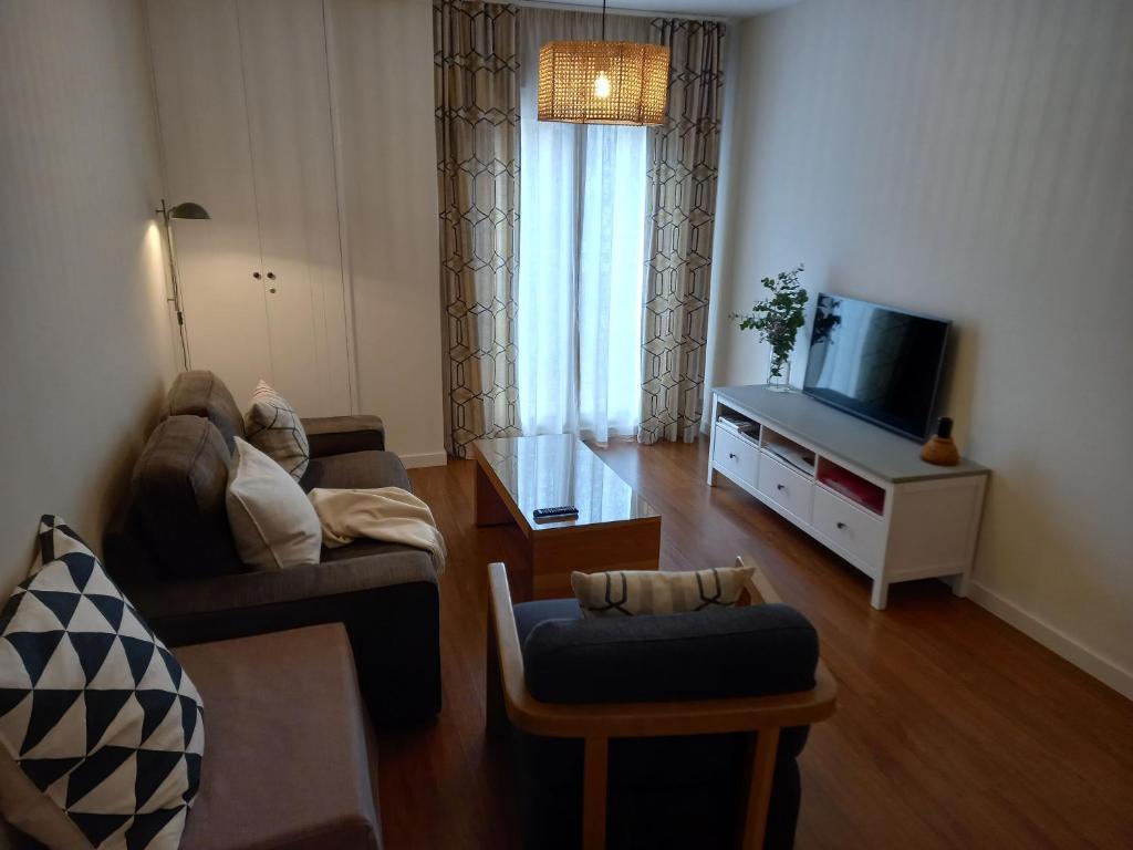TV a/nebo společenská místnost v ubytování Littore TORMES con Parking, AA y Piscina
