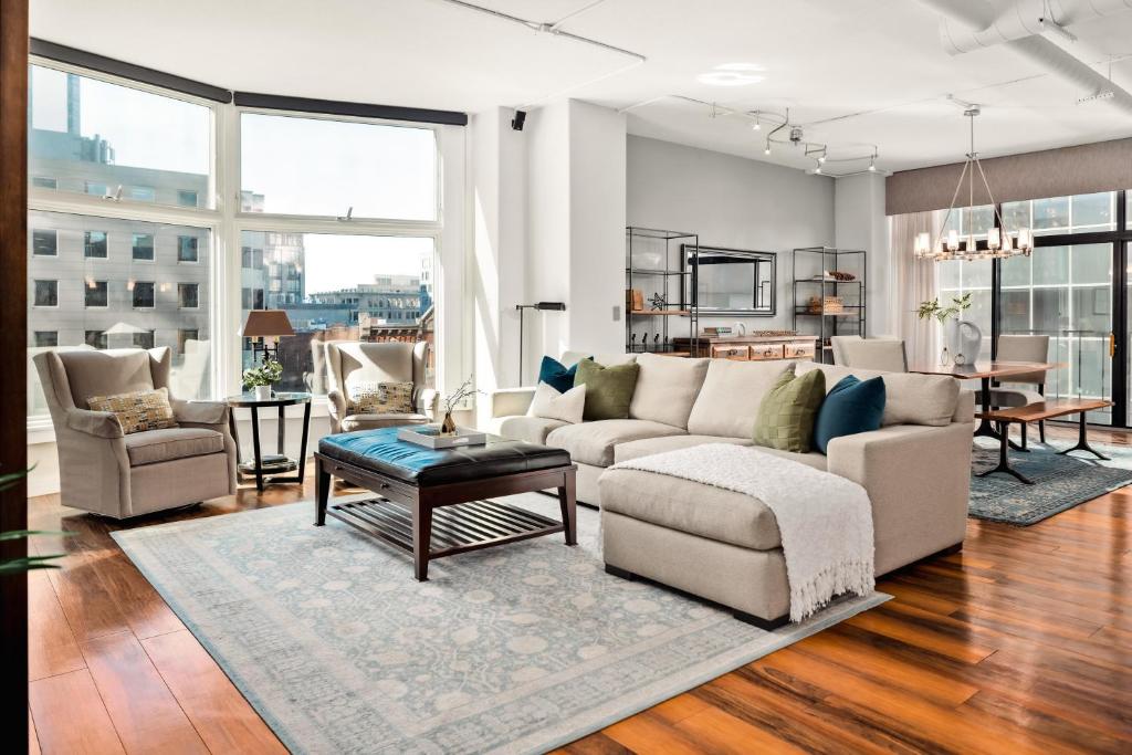 a living room with a couch and a table at Larimer Square Luxury - Office - Downtown Hub in Denver
