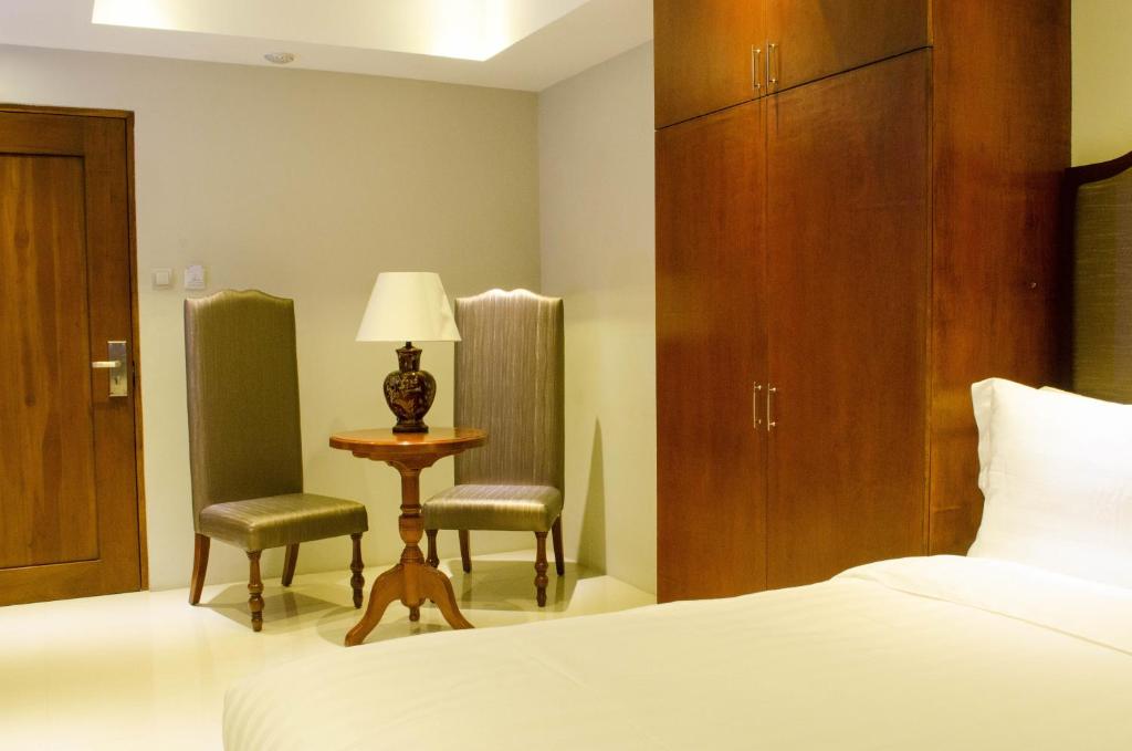 Postel nebo postele na pokoji v ubytování Ritz Hotel Angeles