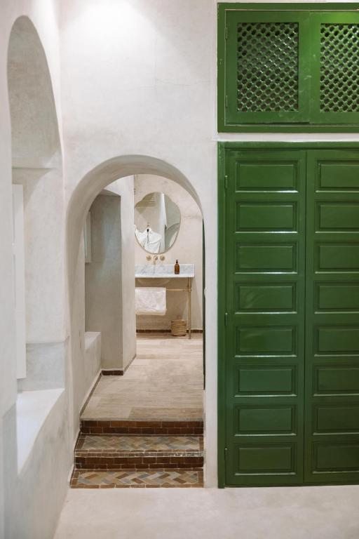 Postel nebo postele na pokoji v ubytování Riad Le Sable Vert