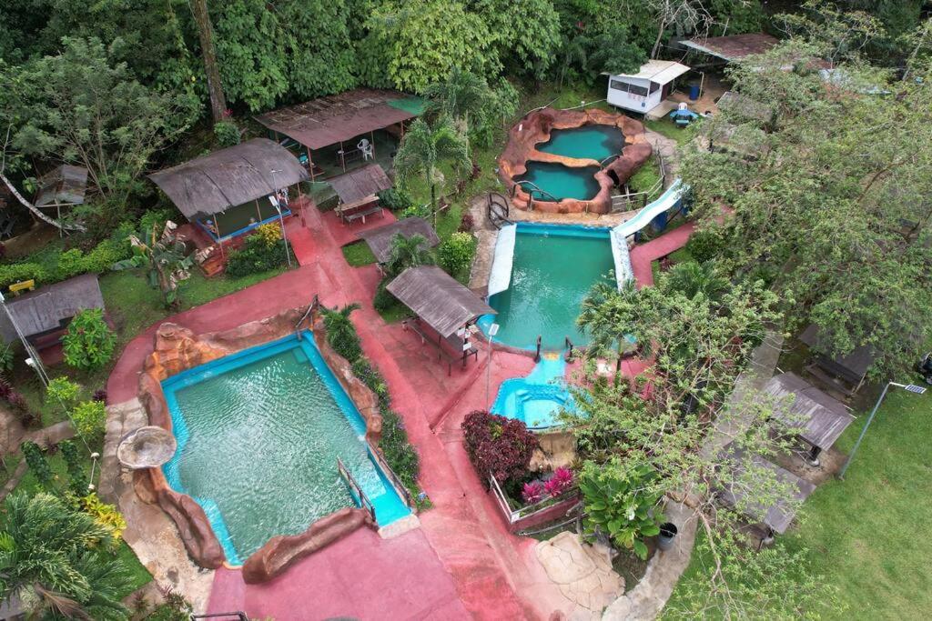 an overhead view of a swimming pool in a resort at BEST PRICE HOUSE in Hot Springs Near La Fortuna in Quesada